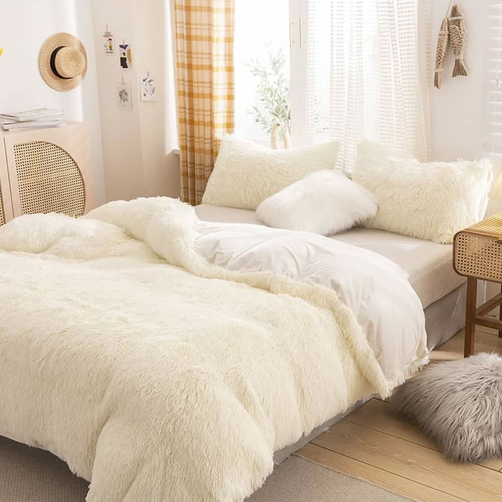 A plush bedding set on a made bed